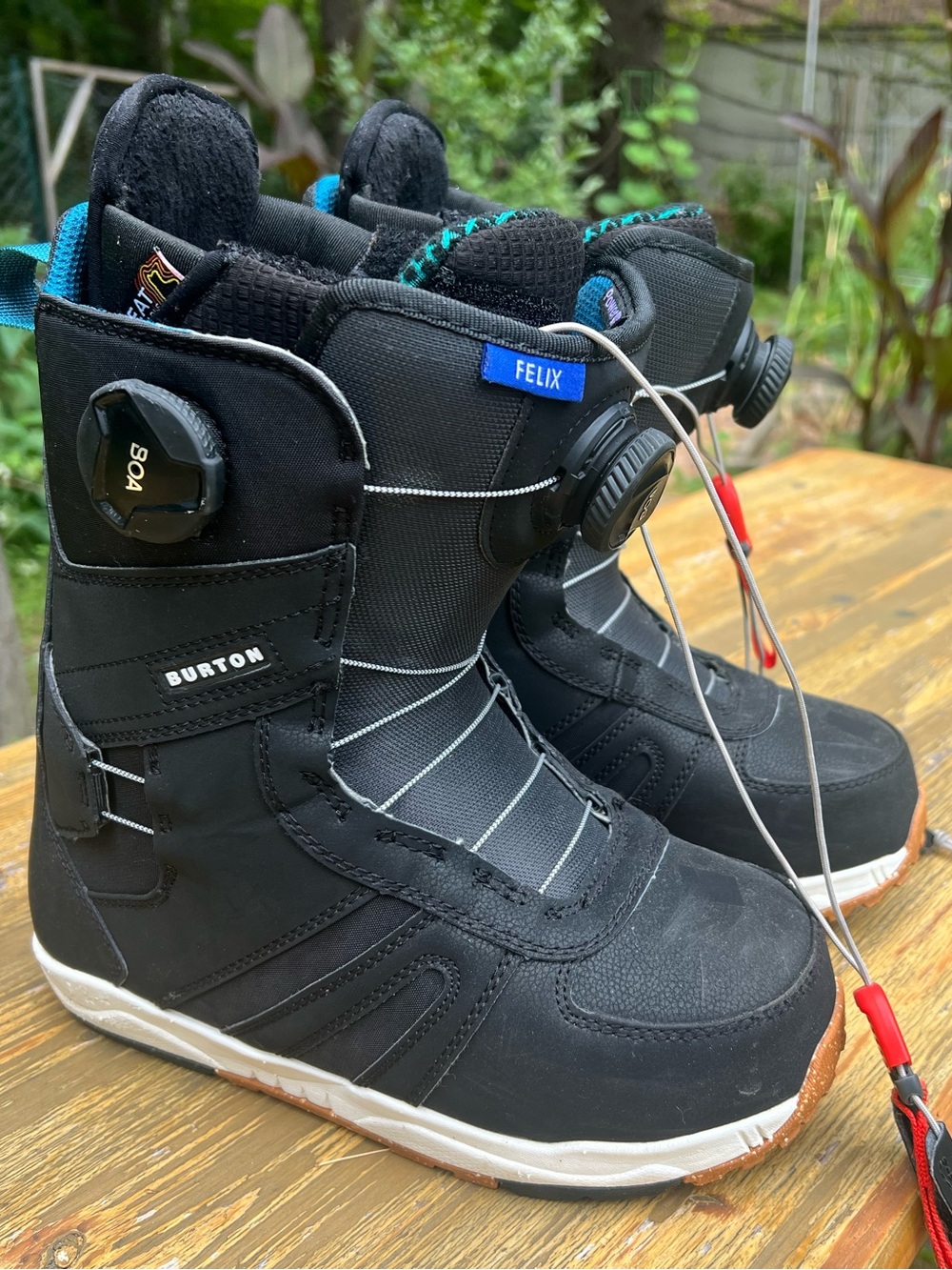 Burton Black Winter Boots with Teal Accents and Red Pull